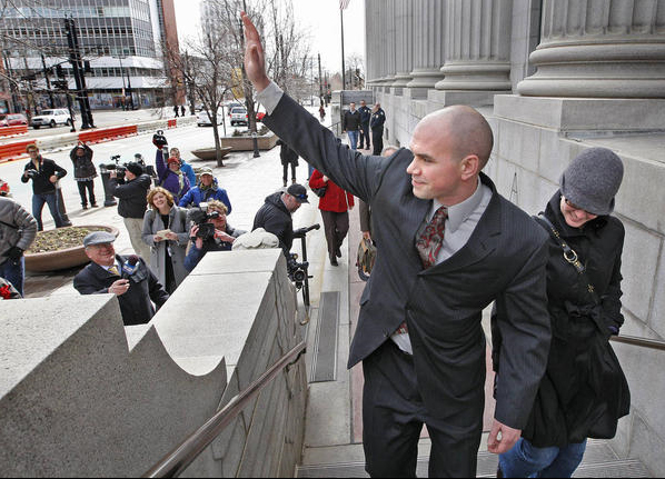 Tim DeChristopher waves to supporters across the street demonstrating as he enter Federal Court for trial for facetiously staking a claim to 13 parcels of land for nearly $1.8 million, which could send him to jail for 10 years, Monday, Feb. 28, 2011, in Salt Lake City, Utah. (Tom Smart, Deseret News)