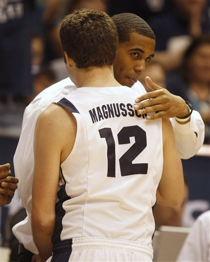 BYU's Brandon Davies, right, is hugged by his teammate Logan Magnusson during a game against Wyoming. (AP Photo/George Frey)
