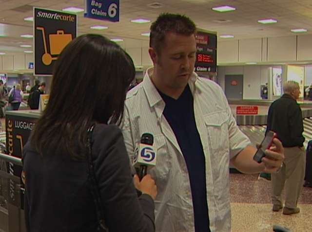 Stewart Christensen shows KSL's Jennifer Stagg cell phone video he captured of the earth shaking during an aftershock.