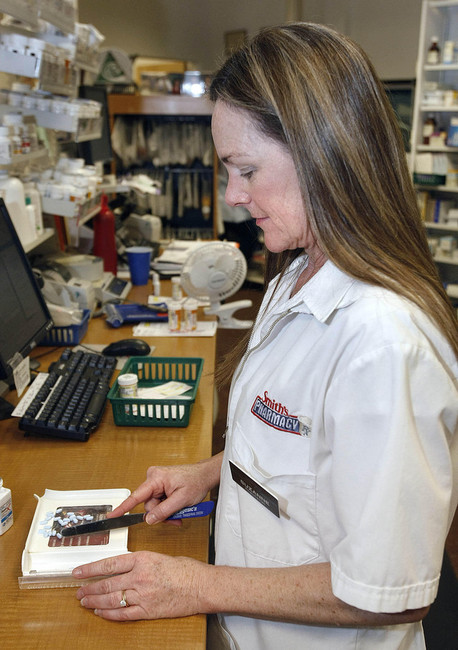 A pharmacist at Smith's Marketplace in Salt Lake City counts out Chantix pills, a drug for smoking cessation. Smith's has partnered with the Utah Department of Health to offer stop-smoking medications free of charge to uninsured Utahns.