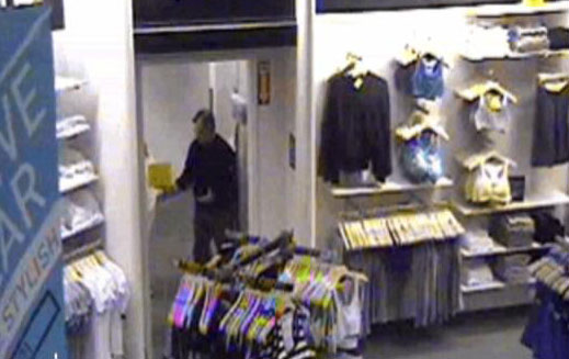 This image taken from Forever 21's surveillance video shows the suspect in the fitting room area of the store.