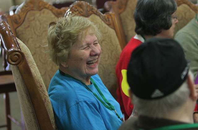 Patrons play with a parachute and balloons at the Aspen Senior Center in Provo. The center helps Alzheimer's participants with mental stimulation, socialization, nutrition and exercises.
