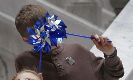 Jack Coleman uses his pinwheels as eyes at the state Capitol during a press conference at the state Capitol Monday, April 4, 2011, in Salt Lake City.