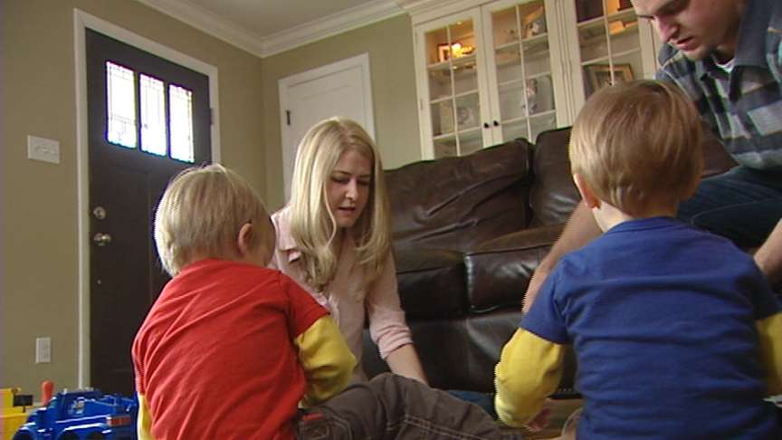 Julie Hendrickson and her husband, David, play with their twin boys, Benjamin and Jackson.