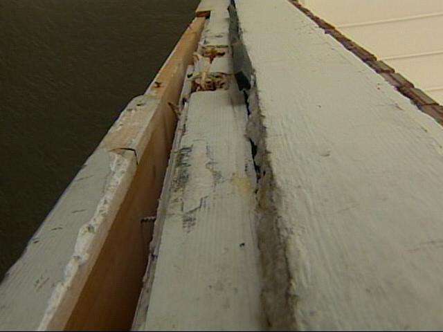 After the wife escaped to a nearby home, the husband kicked in the door.