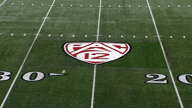 Pac-12 logo placed on Rice-Eccles Stadium turf
