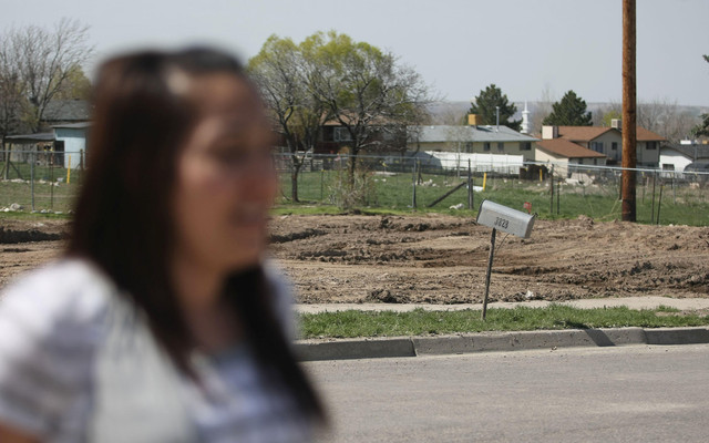 Bailey Sanchez speaks about being forced out of her home for UDOT expansion. Across the street, an empty lot sits where one of Sanchez's childhood friends used to live. (Lennie Mahler, Deseret News)