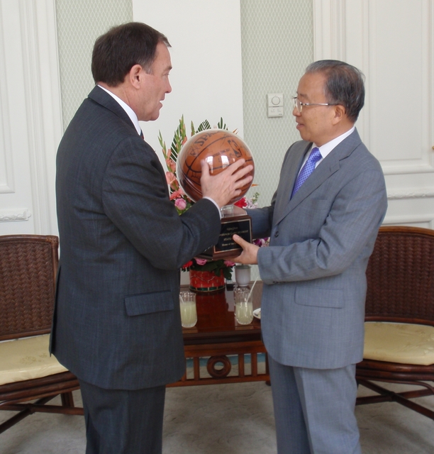 Gov. Gary R. Herbert presents a Utah Jazz basketball signed by the team to Dai Bingguo, State Councilor of the People's Republic of China.