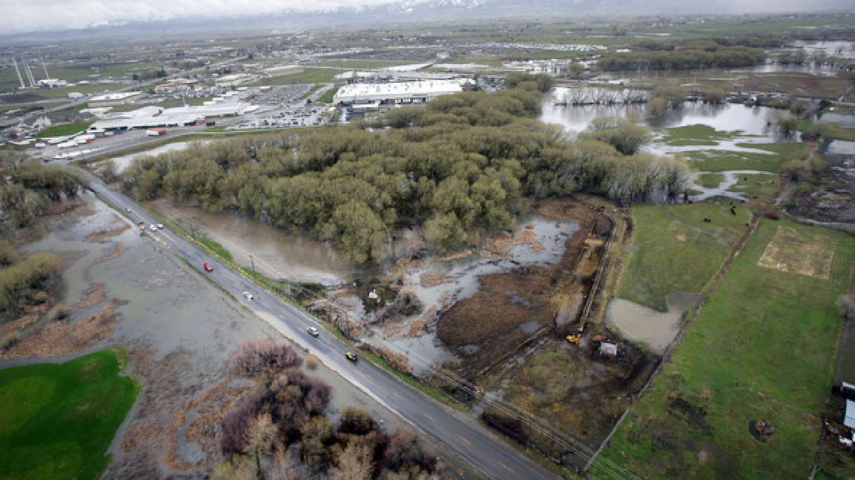 High water spills out over the river banks in Logan on April 18, 2011. Logan Mayor Holly Daines issued an executive order Thursday declaring the Logan River a disaster area because of flooding risks.
