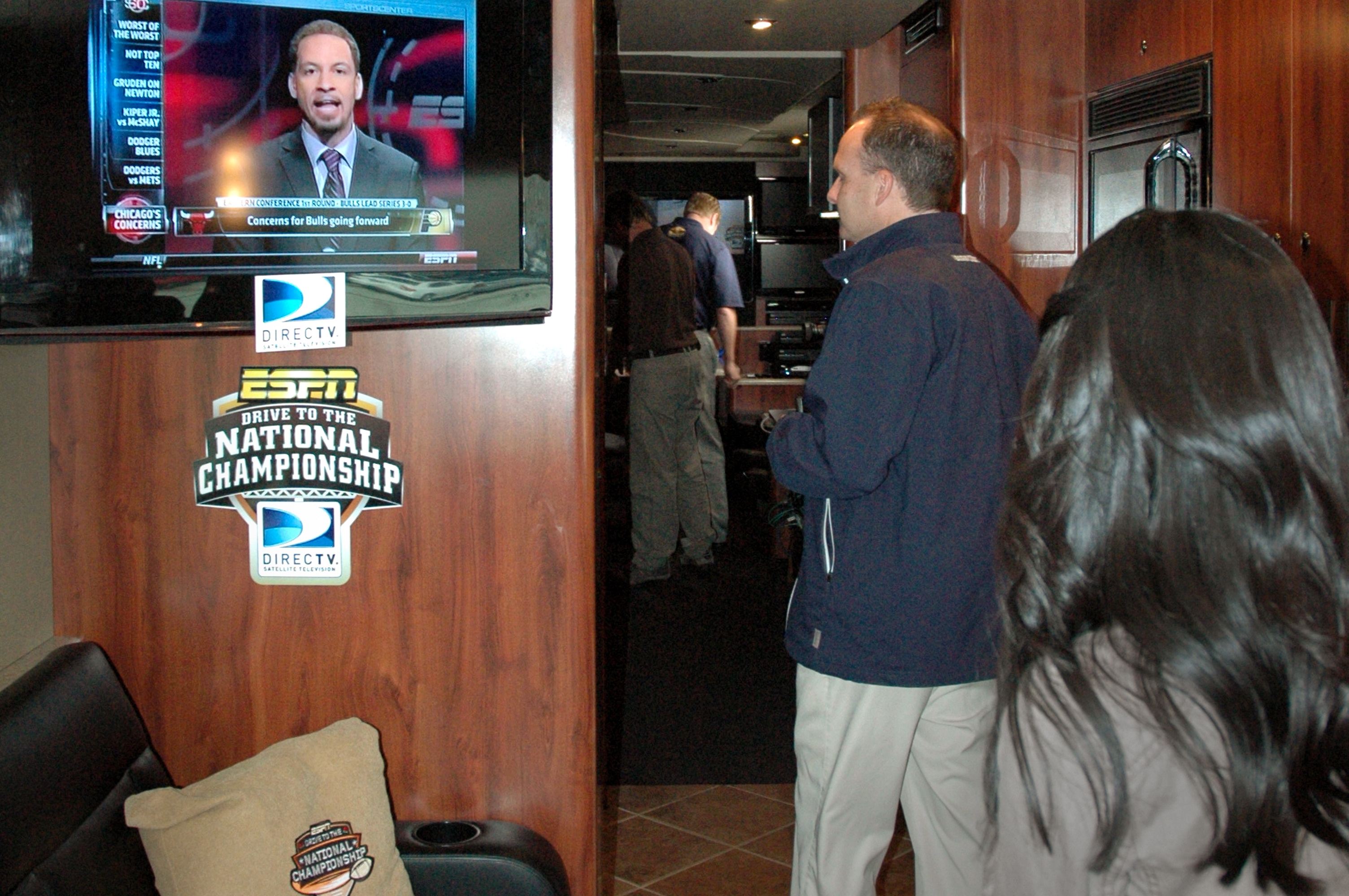 Hi-def comforts of home on the big bus (Bronco's assistant Carey Hoki in the foreground with BYU Football Media Relations Director Brett Pyne).