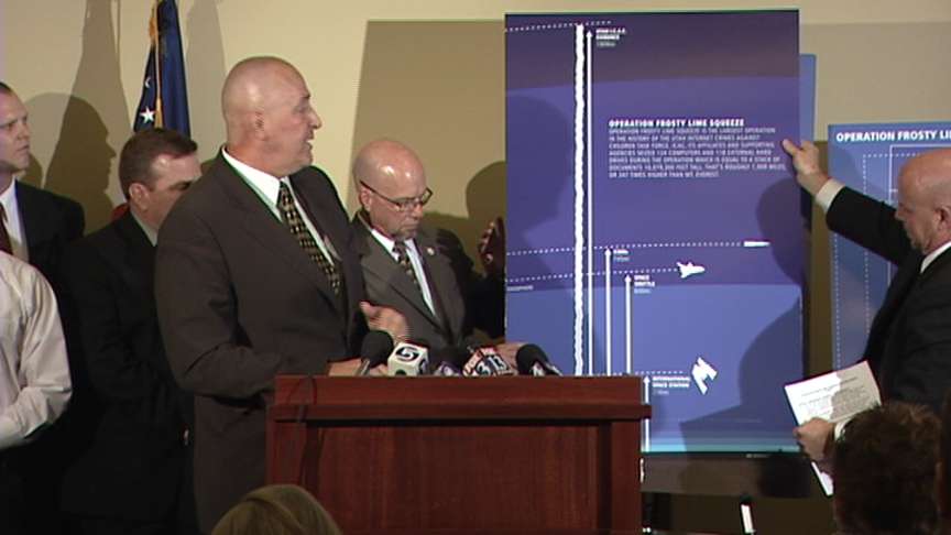The images seized would stretch 1,909 miles high if printed. Utah Attorney General Mark Shurtleff shows a chart illustrating this point, showing the stack in space (far left) compared to the space shuttle (second from right) and space station (far right).