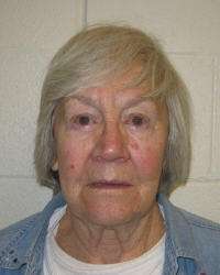 Evelyn Christine Johnson, 74, is charged in 8th District Court with murder, a first-degree felony. Johnson is accused of fatally shooting her estranged husband on Aug. 24, 2004, as the couple drank coffee.