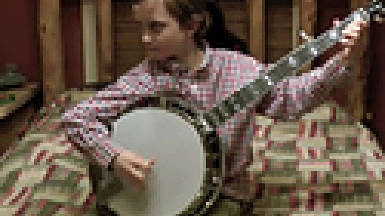 8-Year-Old Kid Shreds On The Banjo