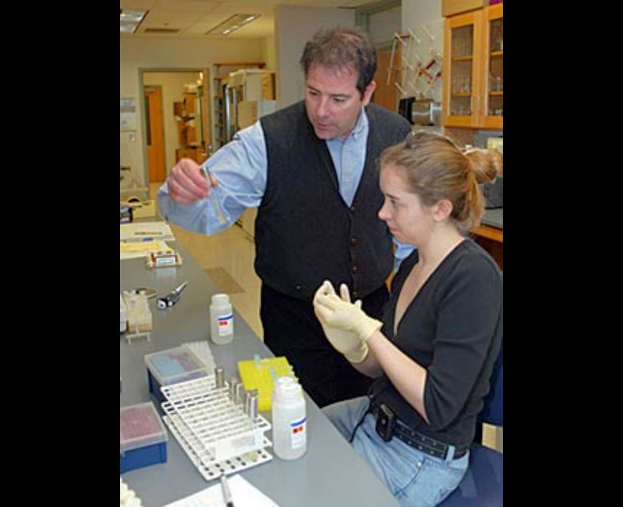 Professor and lead researcher Laurence Zwiebel talking with a student in the lab. (Neil Brake/Vanderbilt)