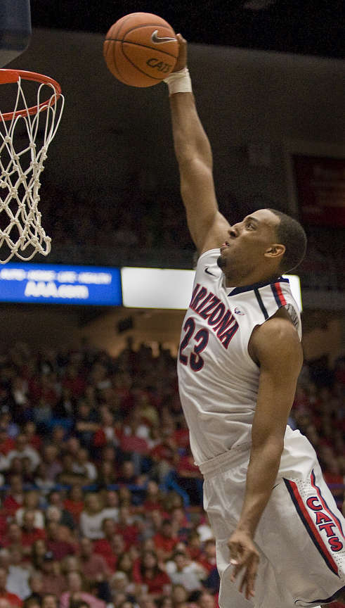 Arizona's Derrick Williams dunks the ball against Washingtion State in the second half of an NCAA college basketball game at McKale Center in Tucson, Ariz., Thursday, Feb. 17, 2011. Arizona won 79-70. (AP Photo/Wily Low)