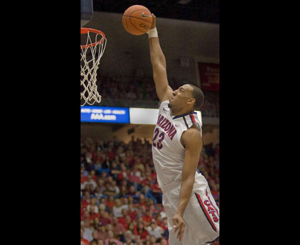 Arizona's Derrick Williams dunks the ball against Washingtion State in the second half of an NCAA college basketball game at McKale Center in Tucson, Ariz., Thursday, Feb. 17, 2011. Arizona won 79-70. (AP Photo/Wily Low)