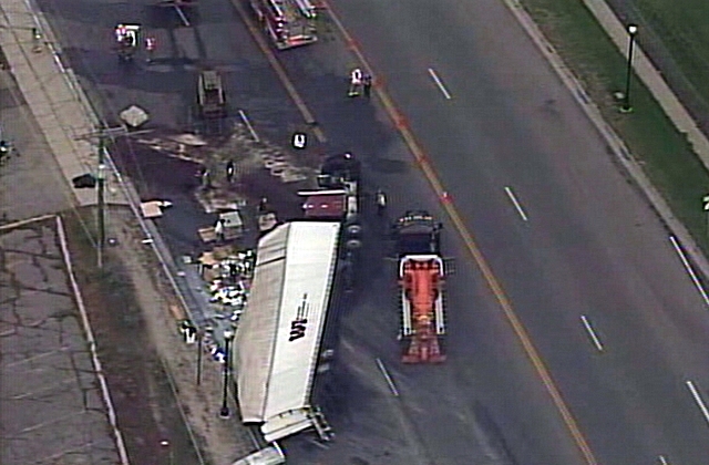 Semi loses brakes, overturns, hits 3 cars in Brigham City