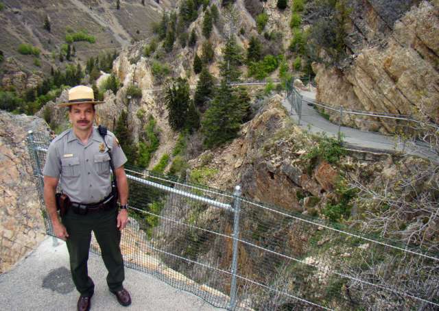 A ranger highlights the improvements made along the trail.