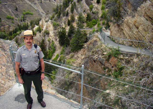 A ranger highlights the improvements made along the trail.
