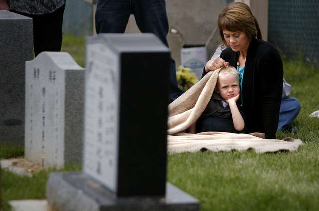Karen Lambert and her grandson Joshua Nielson attend a memorial service to honor 142 people who gave their bodies to science and education at the University of Utah. Karen's father donated his body this past year. At first, Lambert thought it would be difficult to not have a traditional funeral service for her father but now says, "It's been a gift. It really has, this whole experience."