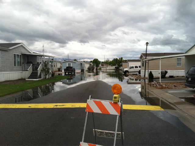 Flooded street in West Valley City Monday morning.