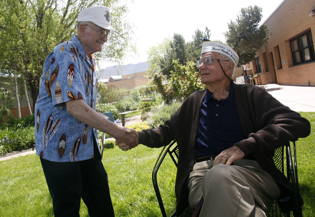 Marion Kesler greets Max Burggraaf during the Annual Pearl Harbor Survivors Picnic at the George E. Wahlen VA Medical Center Gem Court Garden in Salt Lake City on Jun. 4, 2011.