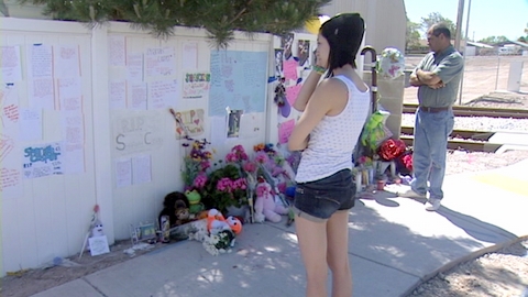 Gina Martinez, a classmate of Sharia Casper's, views the memorial that's sprung up in the teen's honor.