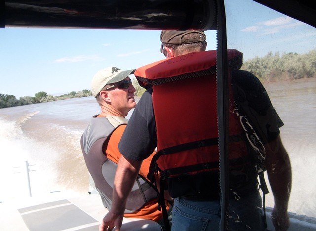 Emery County Capt. Kyle Ekker and Sheriff Greg Funk talk about flooding while on the swollen Green River recently. (Amy Joi O'Donoghue, Deseret News)