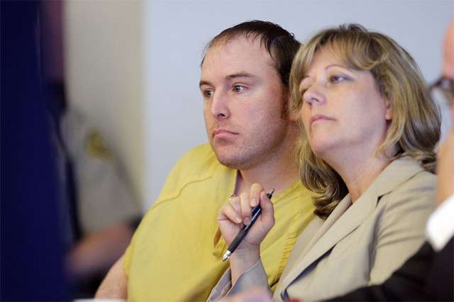 Breck listens with his attorneys during a preliminary hearing Tuesday.