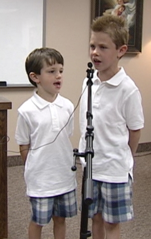 Carter Ragsdale (left) and his brother, Brandon Ragsdale (right), sing as part of a presentation given by their grandmother Tuesday evening to the ChainBreaker Foundation in Orem.