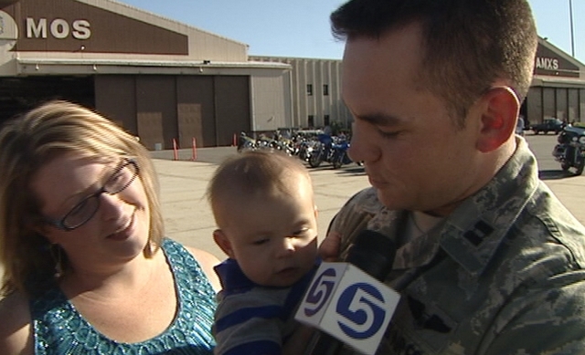 Capt. Neil Dimmitt also got to hold his baby for the first time Tuesday evening.