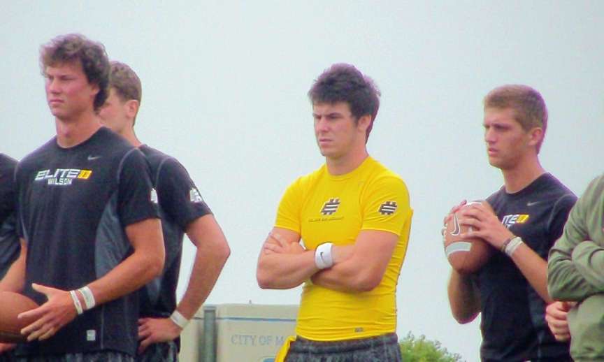 Tanner Mangum (yellow jersey), and Travis Wilson, right, participate in the Elite 11 Quarterback Camp in Malibu, Calif., on Wednesday.