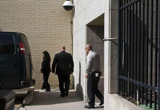 Tim DeChristopher leaves the federal courthouse in custody in Salt Lake City on Tuesday, July 26, 2011. (Mike Terry, Deseret News)