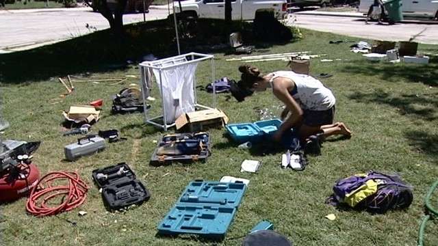 Residents attempt to dry their soaked possessions.