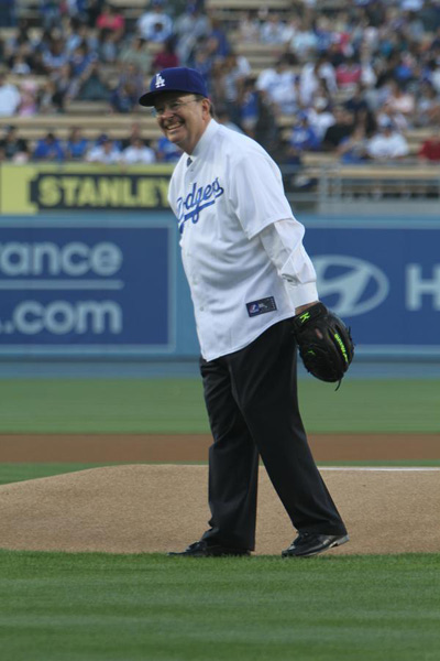 Elder Quentin L. Cook winds up for the ceremonial first pitch at Mormon Night at Dodger Stadium
