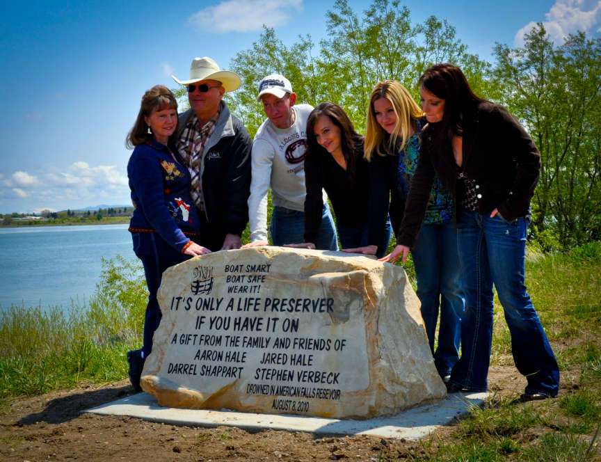 The Hale Family poses for a portrait at a memorial. The Family, who lost two brothers, an uncle and a family friend in a boating accident last year, have started building loaner stations for life jackets at popular water recreation destinations. (Courtesy LaMont Bailey)