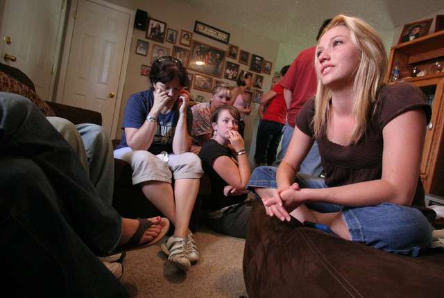 Stephanie Sabin, girlfriend of Sgt. Daniel Gurr, talks about her long-time boyfriend as friends and family listen. Gurr, 21, of Vernal, was killed in action Aug. 5, 2011, in Afghanistan. (Geoff Liesik, Uintah Basin Standard)