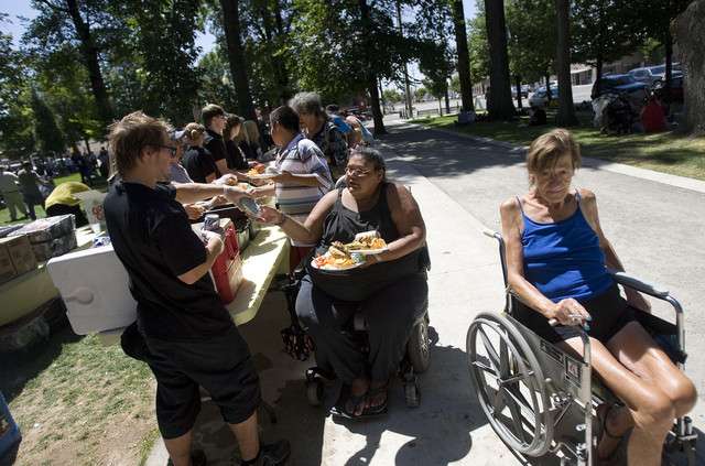 Hundreds of those less fortunate gather wait in line for plates of food during an Salt Lake Mission-Subway Restaurants event. (Photo: Mike Terry, Deseret News)