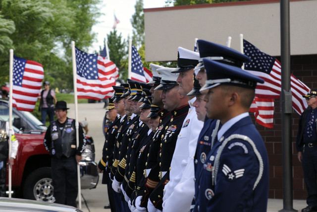 A color guard waits to carry the remains of 16 at the Utah Veterans Cemetery and Memorial Park, Aug. 15, 2001. Utah veteran organizations are urging the state’s vets to file for PACT Act benefits by Wednesday in anticipation of the act’s first anniversary. 