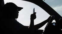 Man Loses License After Using Two Cell Phones While Driving [Texting]
