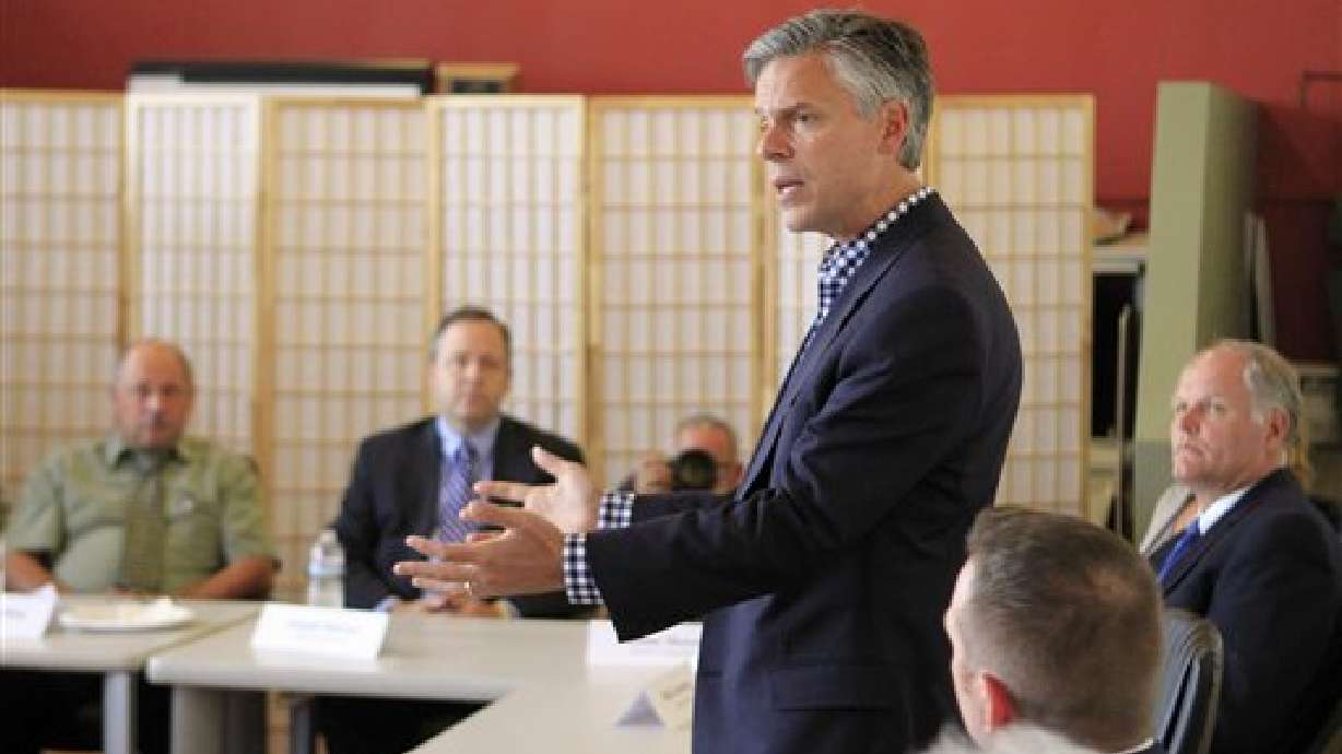 Huntsman pounds Perry on climate change and Fed