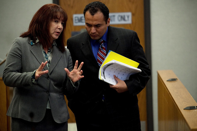 Ramon Alfredo Somoza speaks to his attorney Barbara Gonzales during his 4th District Court murder trial in Provo Thursday, Sept. 1, 2011.