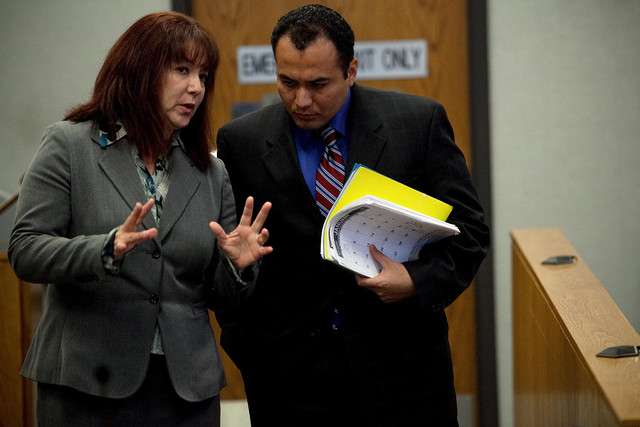 Ramon Alfredo Somoza speaks to his attorney Barbara Gonzales during his 4th District Court murder trial in Provo Thursday, Sept. 1, 2011.