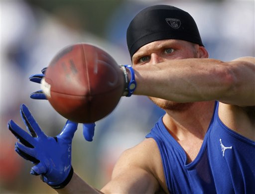 Indianapolis Colts wide receiver Austin Collie makes a catch during training camp. (AP Photo/Michael Conroy)