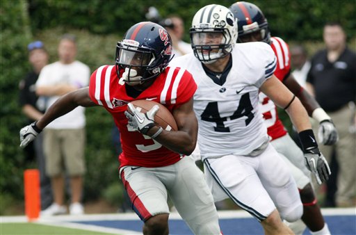 Mississippi running back Jeff Scott (3) sprints past BYU linebacker Brandon Ogletree (44) for a second quarter 44-yard punt return. (AP Photo/Rogelio V. Solis)