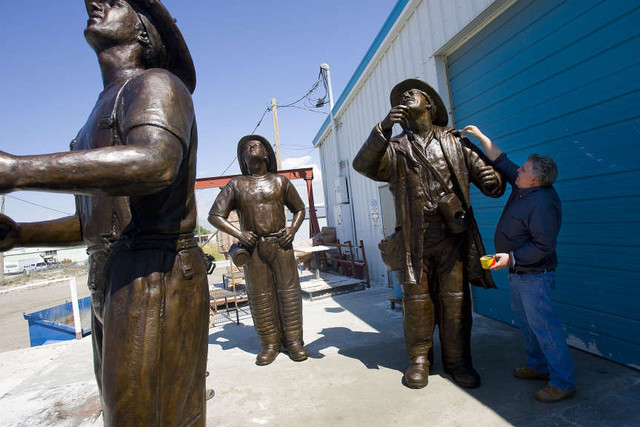 Stan Watts who has his studio in Kearns will be delivering the three firemen statue set to Sandy City Hall later this week to be unveiled as part of a 9/11 memorial. Wednesday, Sept. 7, 2011. (Mike Terry, Deseret News)