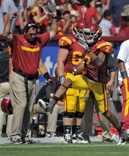 USC wide receiver Robert Woods runs along the sidelines against Minnesota on Saturday. USC won 19-17. (AP Photo/Mark J. Terrill)