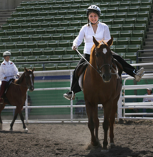 Kelsie Wagner, right, and Diane Merrill exit the arena after competing in a horsemanship show with other members of the Camp Kostopulos Equestrian Team at the Utah State Fair on Wednesday, September 14, 2011. Both riders received a first-place blue ribbon. (Photo: Laura Seitz, Deseret News)