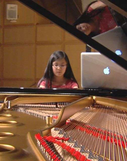 Shayna Oh practices for Friday night's performance at the Libby Gardner Music Hall at the University of Utah.
