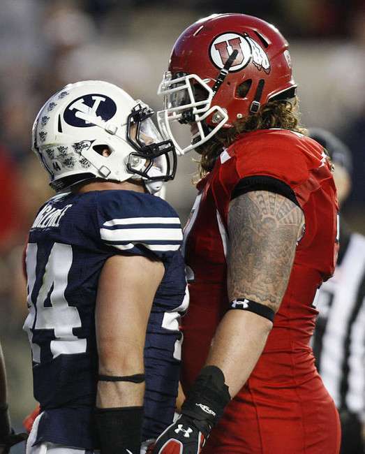 BYU linebacker Brandon Ogletree and Utah
offensive linesman John Cullen get in each
other's face.